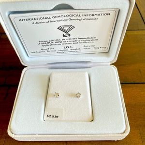 One Pair 14K White Gold Diamond Earrings. 1/2 CT